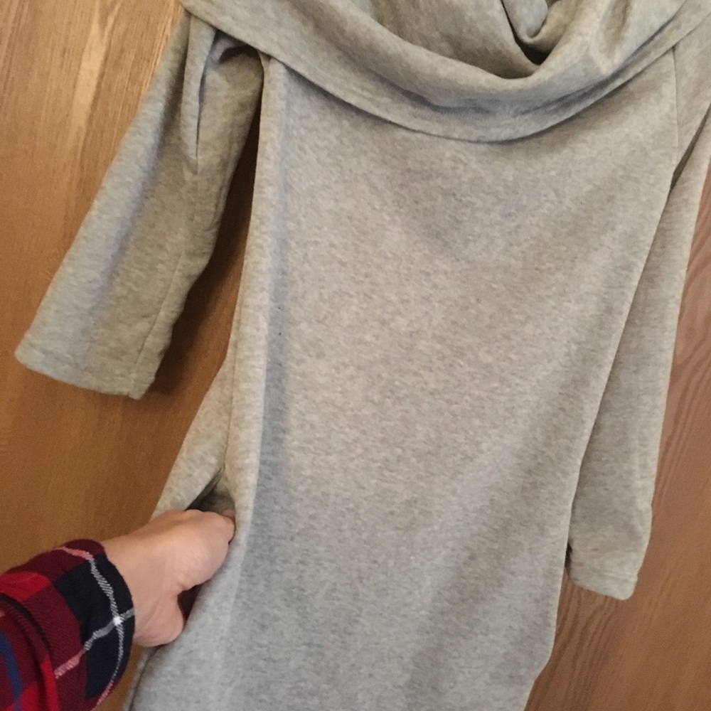 Grey tunic with pockets. Never worn.